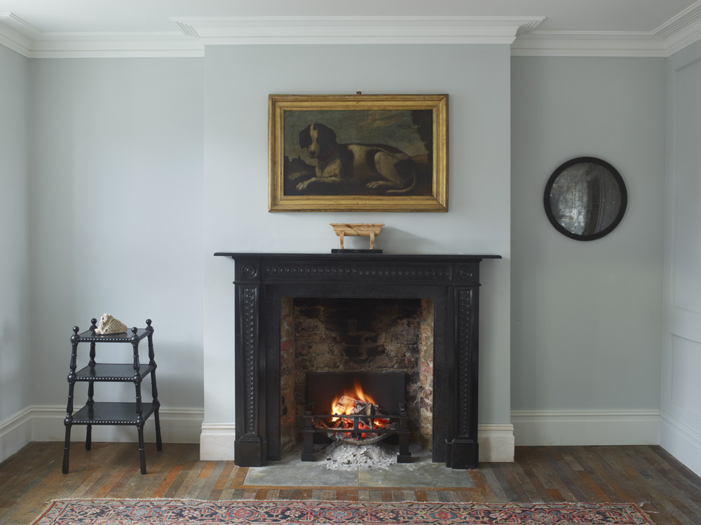 a formal room with real fireplace